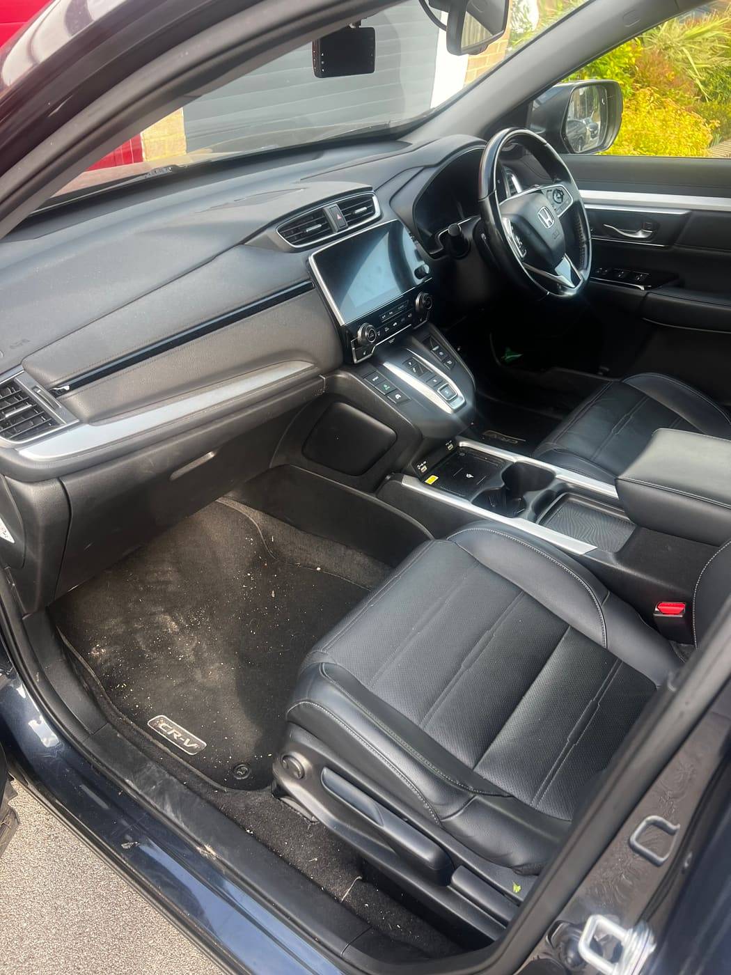 Honda CR V interior before cleaning, marked seats and dusty trim