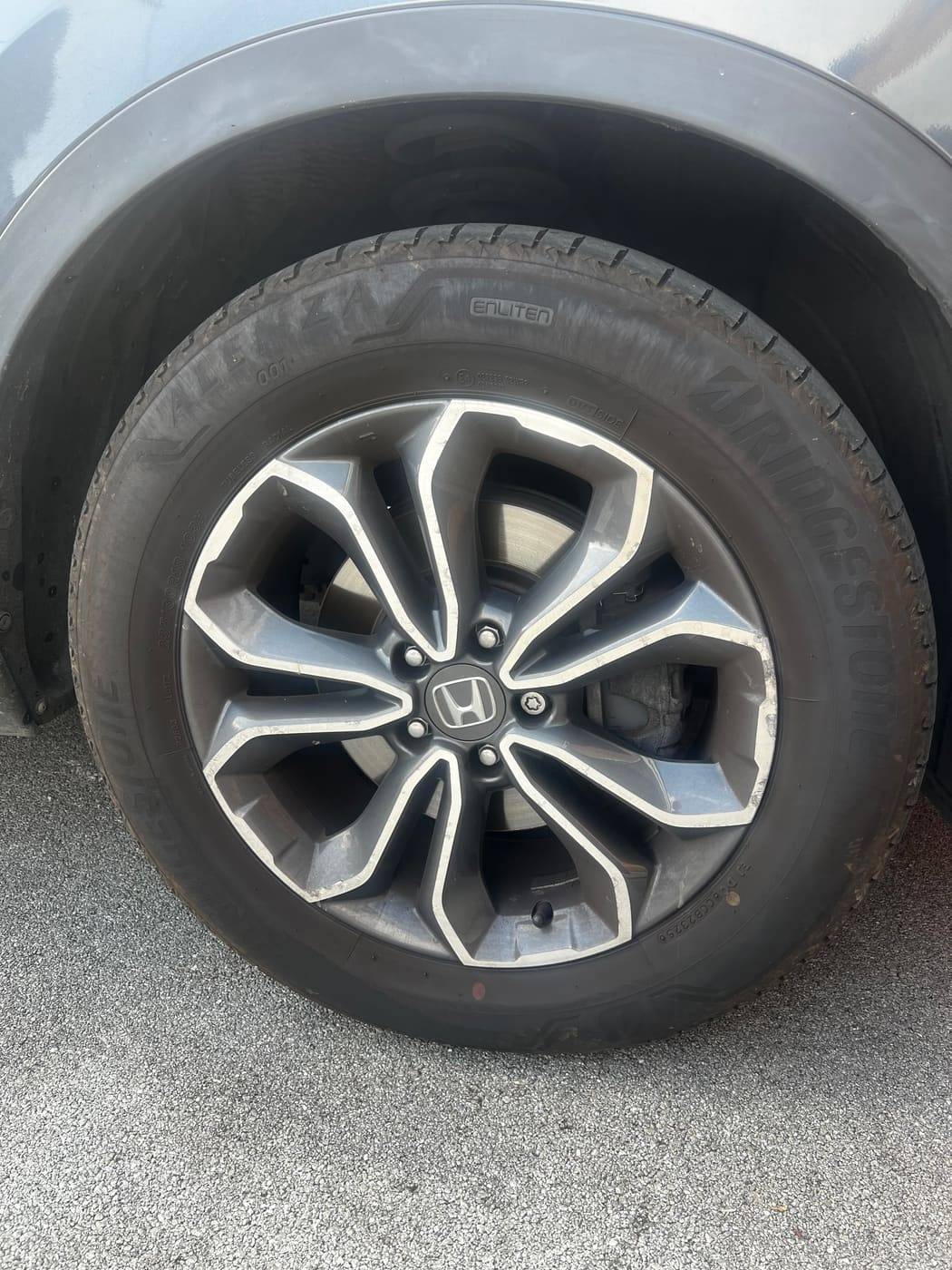 Alloy wheel before cleaning, brake dust across the spokes
