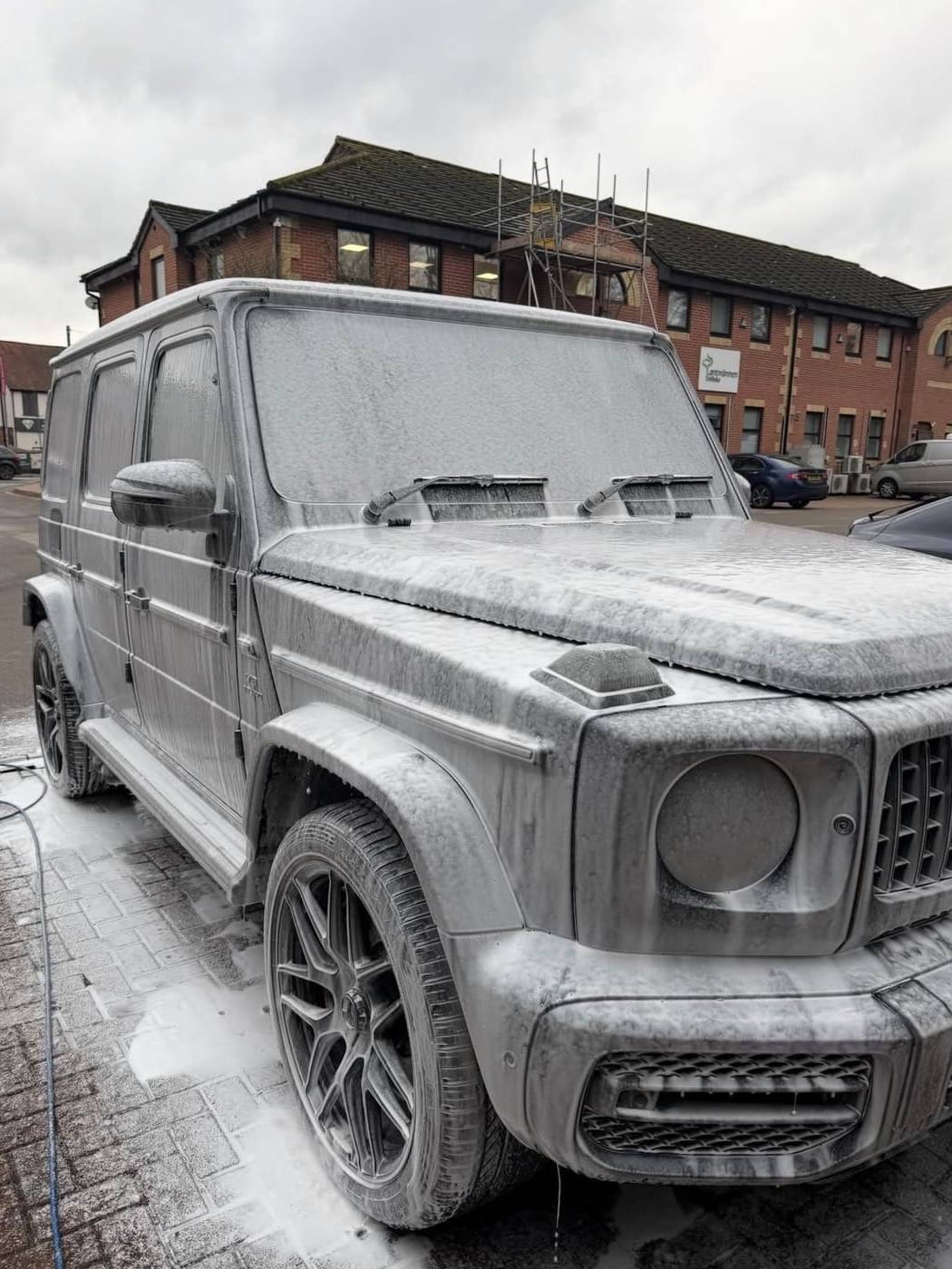Mercedes G Wagon covered in snow foam during the pre wash