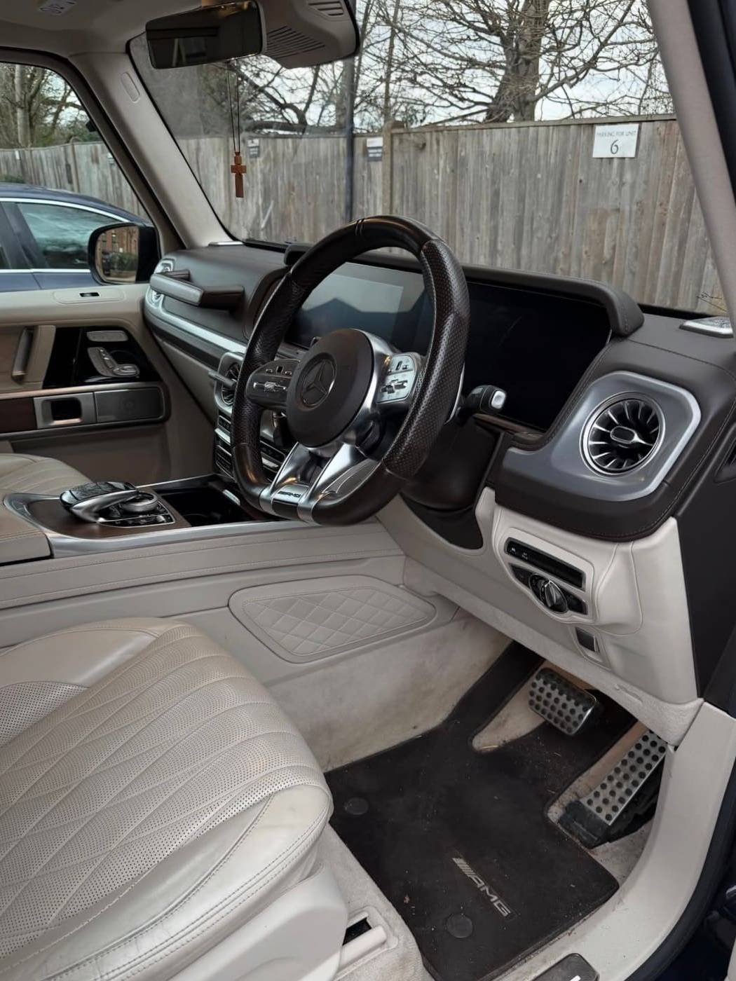 G Wagon cream leather interior before cleaning, dirt in the footwell