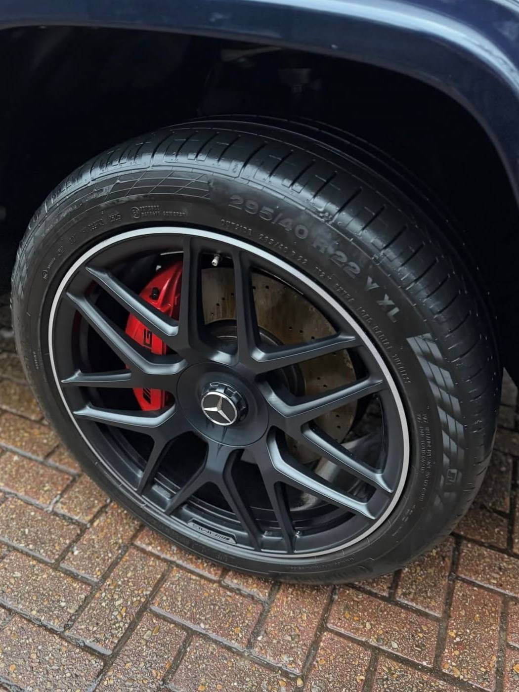AMG alloy wheel after cleaning, with the tyre cleaned and dressed