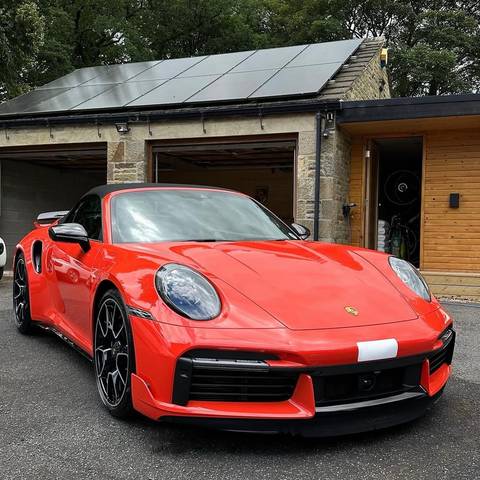 Guards Red Porsche 911 gleaming on a driveway after an Elite Valet