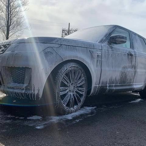 Range Rover Sport covered in snow foam during a mobile wash