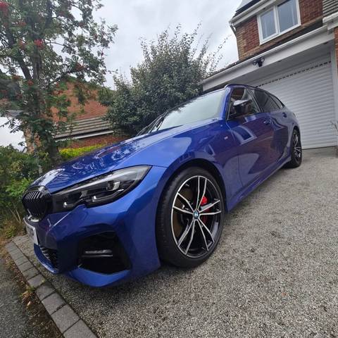Blue BMW 3 Series M Sport cleaned on a driveway