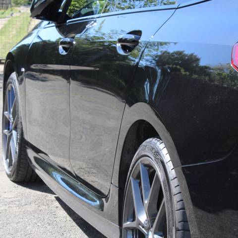 Black BMW 2 Series detailed on location