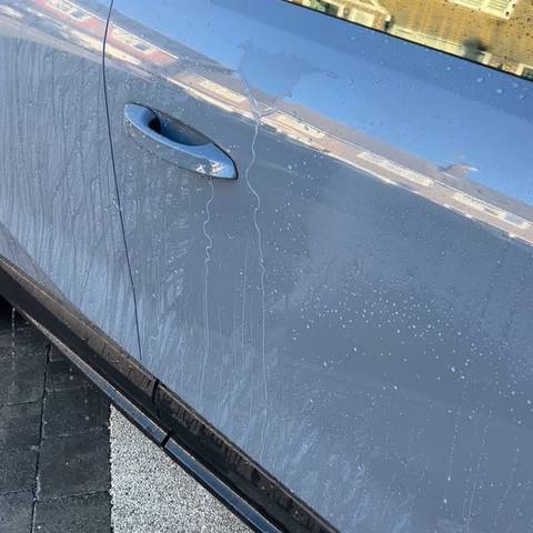 Water beading on a freshly sealed car door